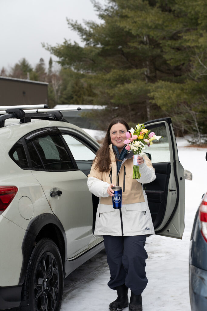 Unpacking the car for a winter Ski Elopement in Maine with Maine huts and Trails 