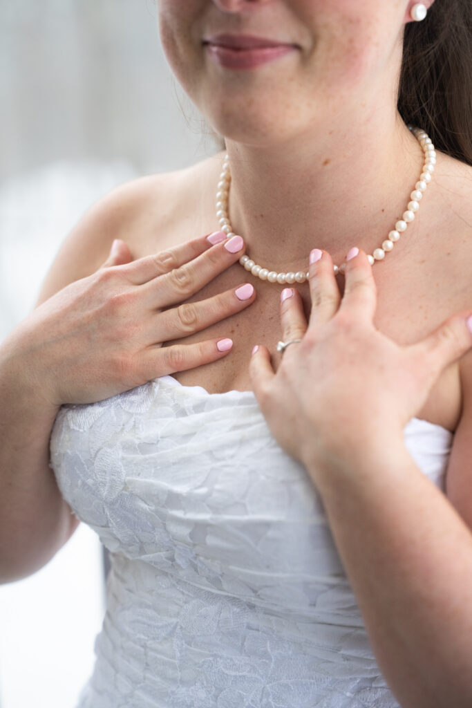 Details dress jewelry for outdoorsy winter elopement in Maine