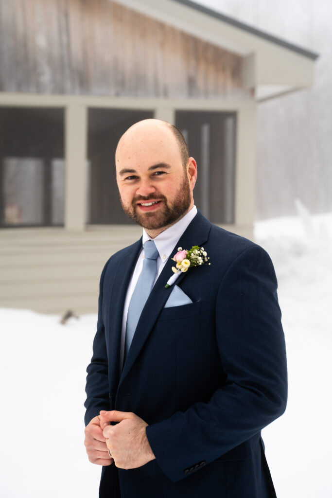 Groom portrait winter elopement Maine Huts and Trails 
