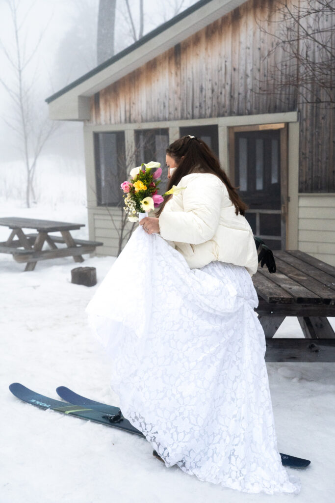 bride in wedding dress on ski's in Maine with Maine Huts and Trails 