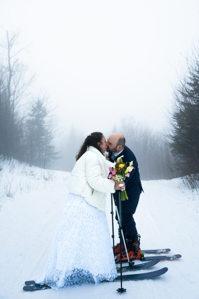 Couple kissing in the fog with Maine Huts and Trails for Elopement 