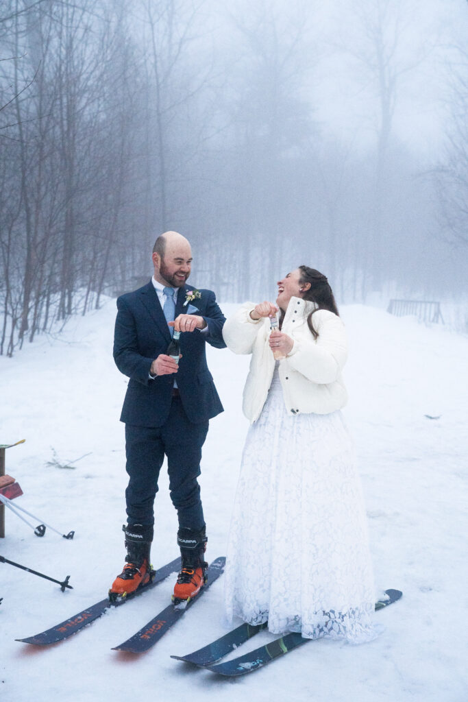 popping champagne for Winter Elopement in Maine 