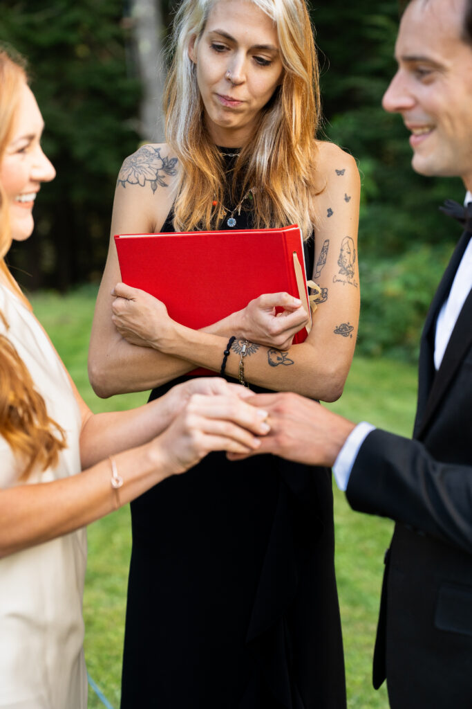 Ceremony exchanging of vows during a fall Maine elopement 
how to elope in 4-8 weeks in Maine 