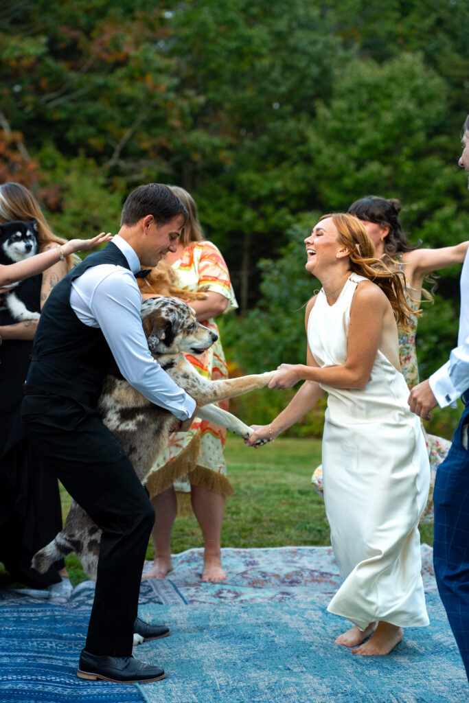 couple eloping with dog present Maine intimate wedding 